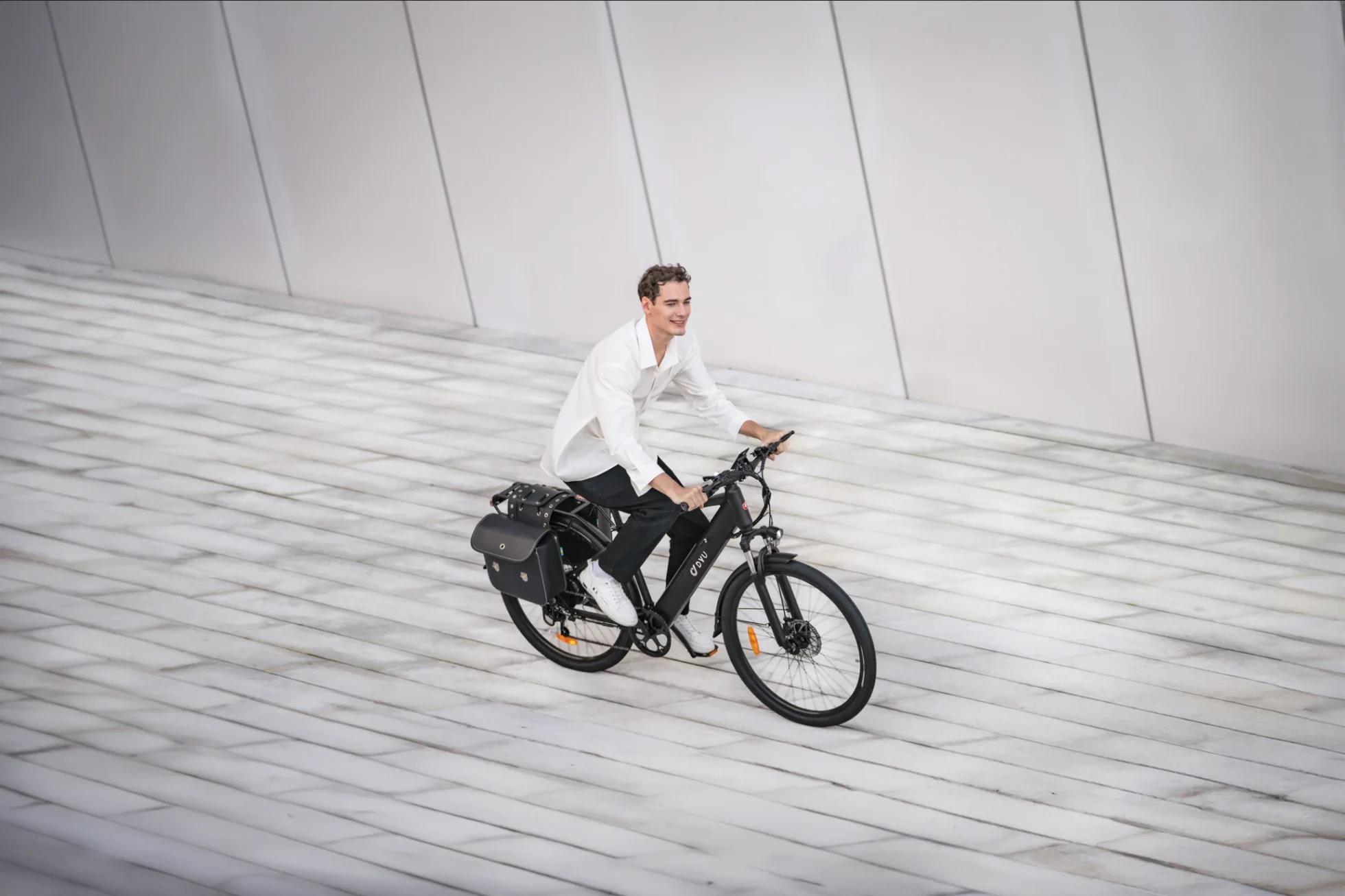 DYU C5 27.5-inch city e-bike riding on a smooth paved surface