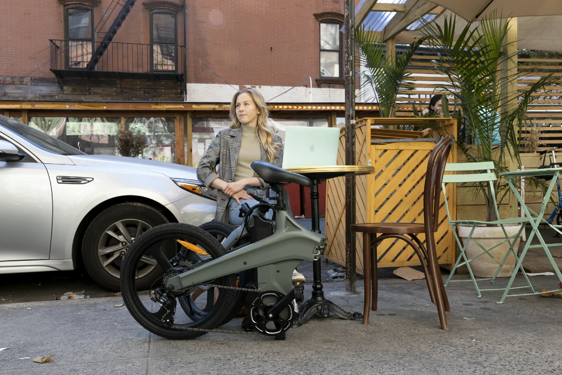 Folding e-bike on a cafe street while planning student storage