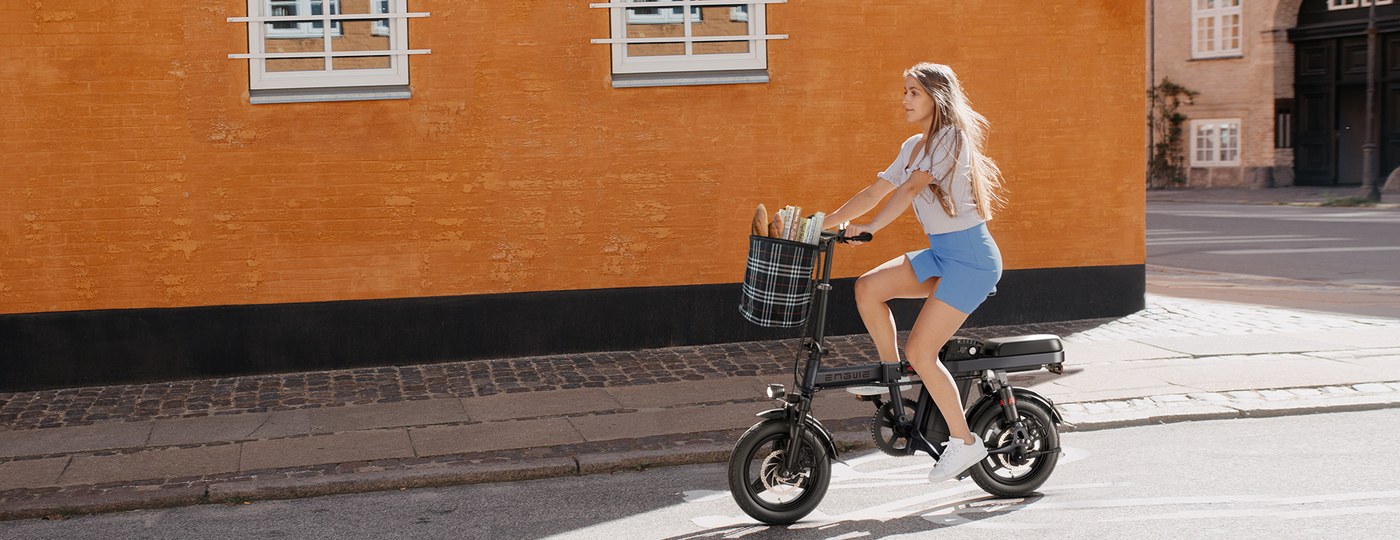 ENGWE T14 rider on a city street during a compact folding e-bike comparison
